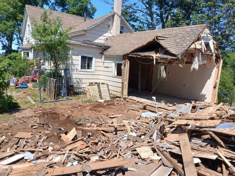 House addition taken down to the foundation with the main house left standing